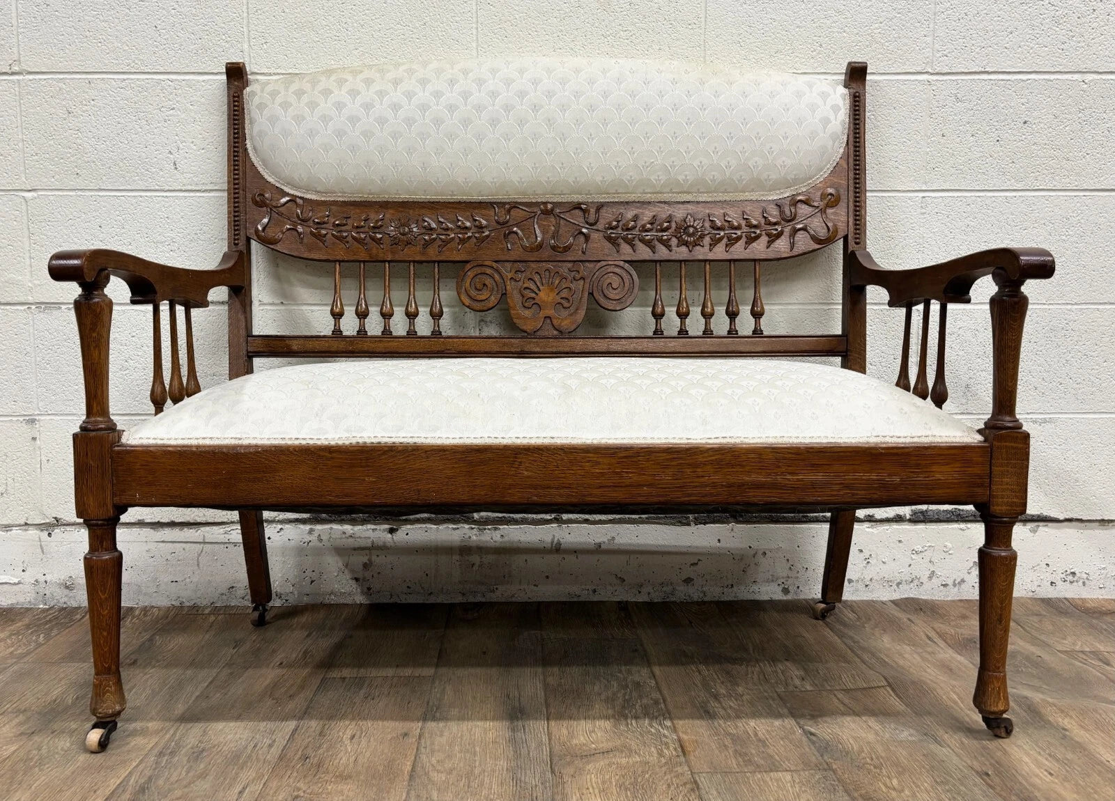 Antique Carved Spindle Back Carved Upholstered Settee