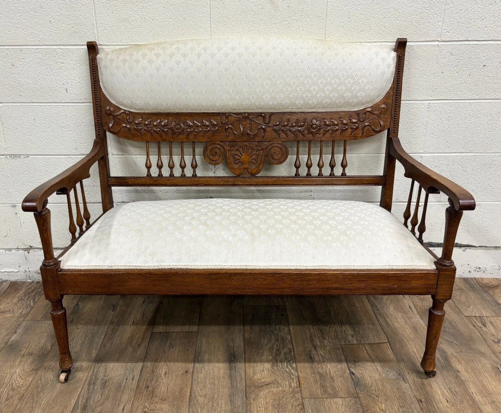 Antique Carved Spindle Back Carved Upholstered Settee