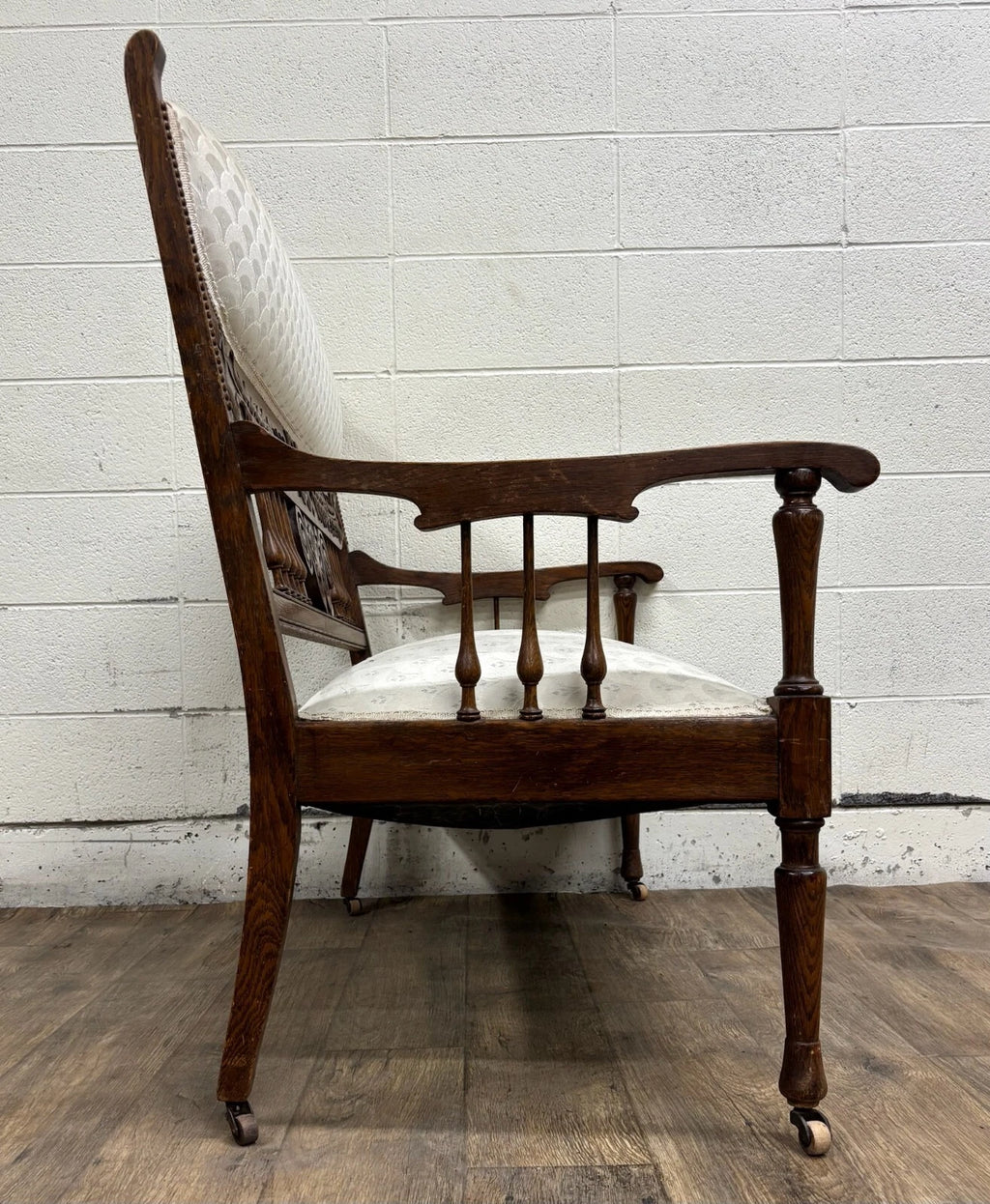 Antique Carved Spindle Back Carved Upholstered Settee