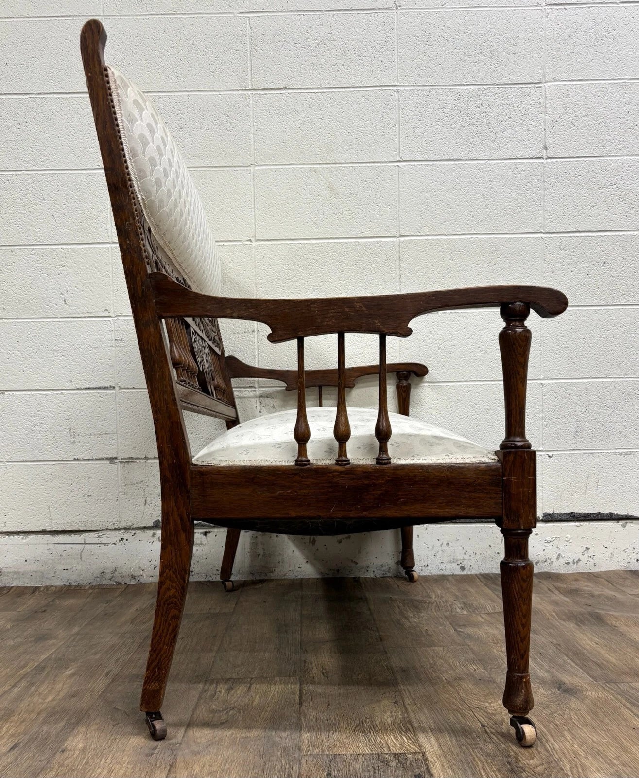 Antique Carved Spindle Back Carved Upholstered Settee