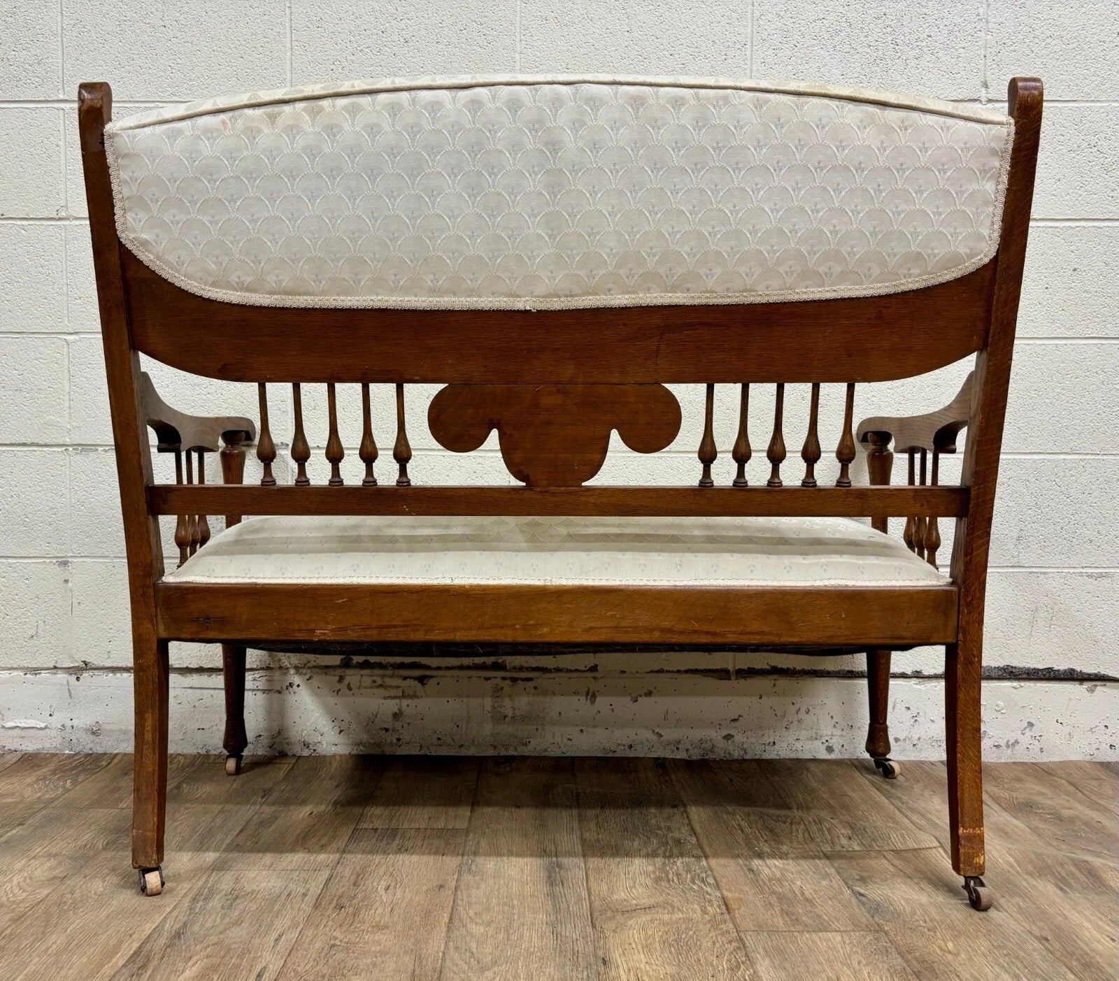Antique Carved Spindle Back Carved Upholstered Settee