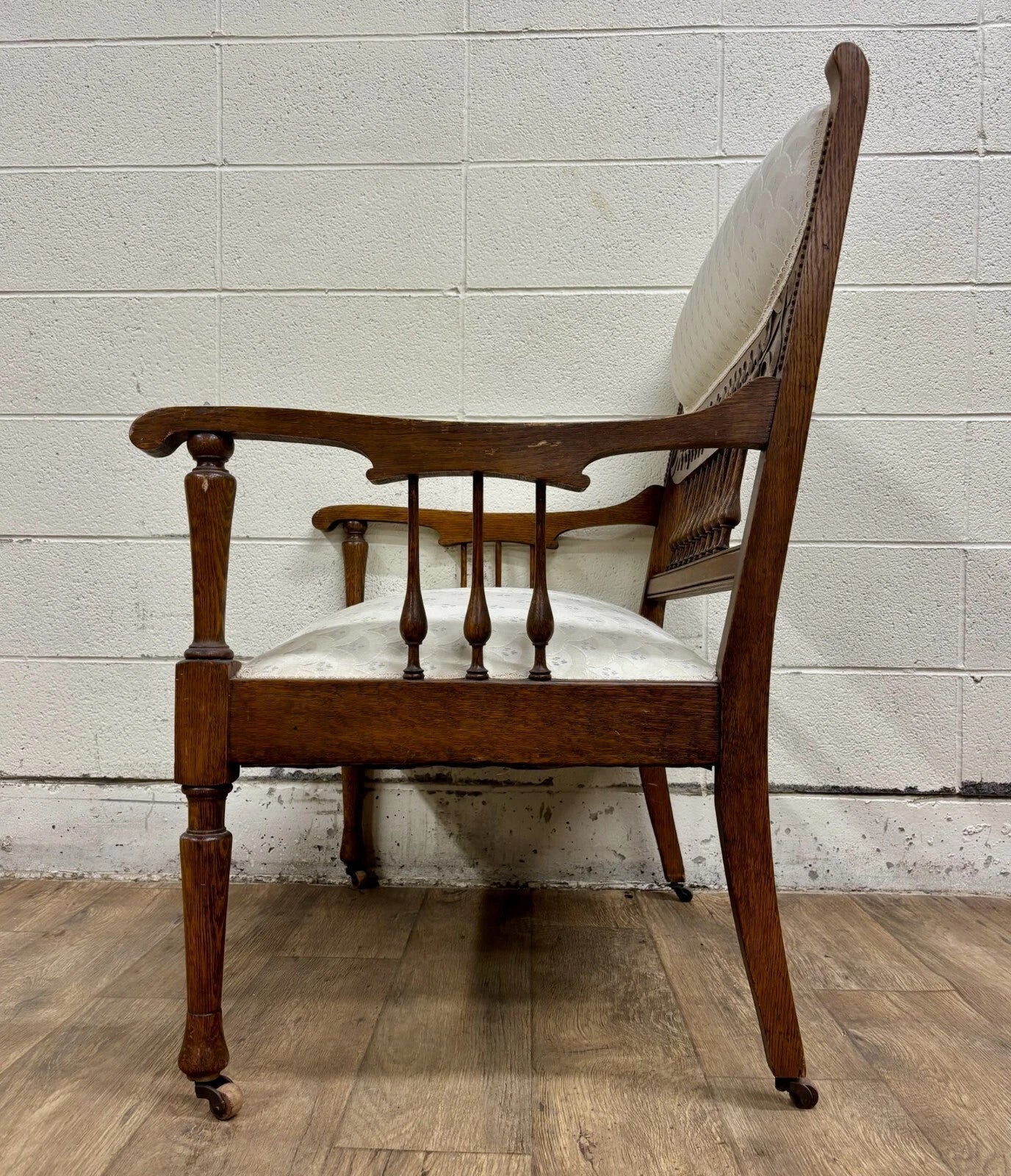 Antique Carved Spindle Back Carved Upholstered Settee